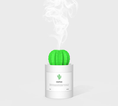 Person holding a glowing white cactus humidifier with a green top; inset shows five white humidifier filter sticks. - Image 2