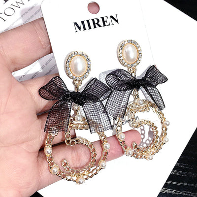 Aretes Circulares Dorados con Perla y Moño - Diseño Elegante y Trendy - Image 9