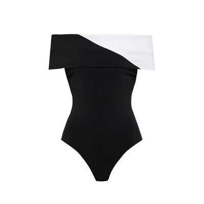 Black one-piece swimsuit with a deep V-neckline and white horizontal stitching detail across the plunge. - Image 35