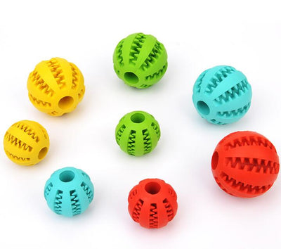 Bright green rubber pet toy ball with textured spikes and ridges for dental cleaning and food dispensing. - Image 4