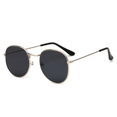 Round metallic sunglasses with iridescent green and gold lenses and a gold-colored metal frame. - Image 29