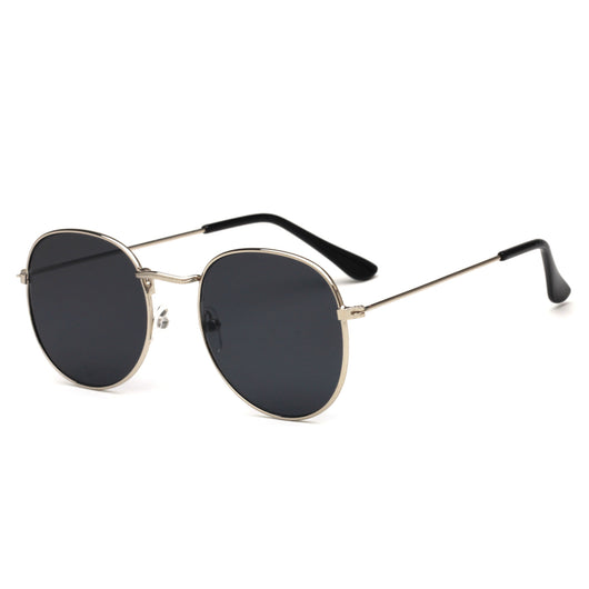 Round metallic sunglasses with iridescent green and gold lenses and a gold-colored metal frame. - Image 29