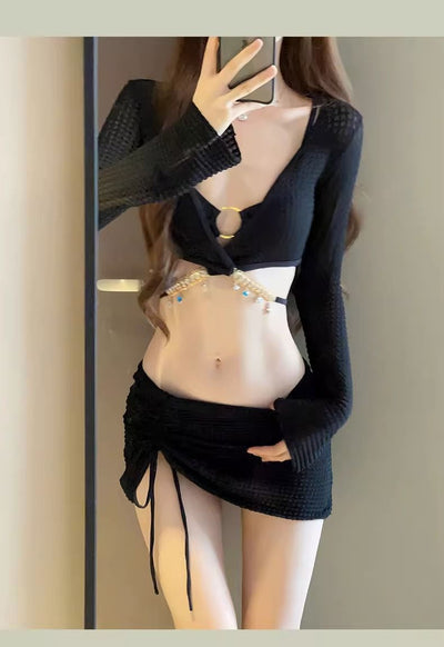 White three-piece bikini swimsuit set with a long-sleeve crop top, bikini top with gold ring, and ruched mini skirt. - Image 15