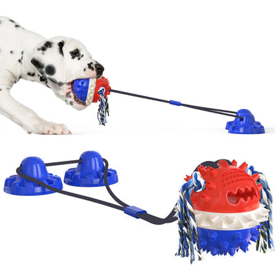 Red, white, and blue textured dog chew toy with rope tassels and a blue suction cup base, shown with a Dalmatian puppy playing. - Image 24