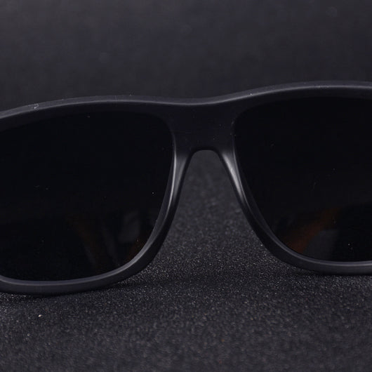Men's grey plastic frame driving sunglasses with dark polarized lenses and red and black stripe detail on temples. - Image 4