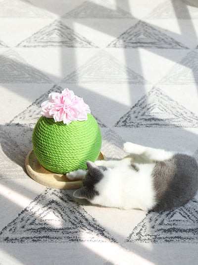 Green rope cat scratching toy shaped like a cactus with a pink flower on top, sitting on a light wood base. - Image 12