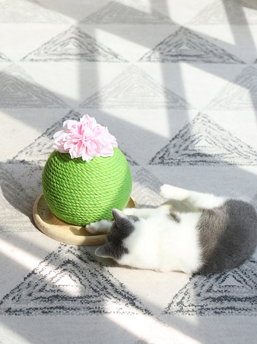 Green rope cat scratching toy shaped like a cactus with a pink flower on top, sitting on a light wood base. - Image 12