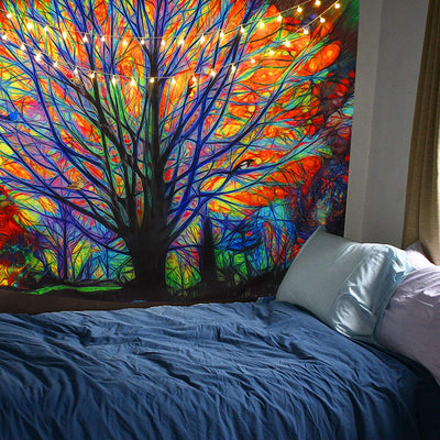 Colorful tree forest tapestry with vibrant abstract art and string lights, hung above a bed with blue bedding.