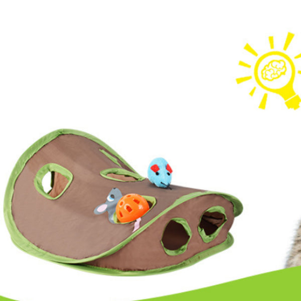 Brown and green cat play tunnel with nine holes, featuring a blue plush mouse and an orange ball with a bell.