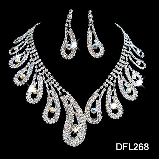 Silver-toned rhinestone necklace and matching drop earrings set with iridescent accents, ideal for bridal or formal wear.