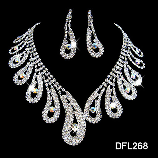 Silver-toned rhinestone necklace and matching drop earrings set with iridescent accents, ideal for bridal or formal wear.