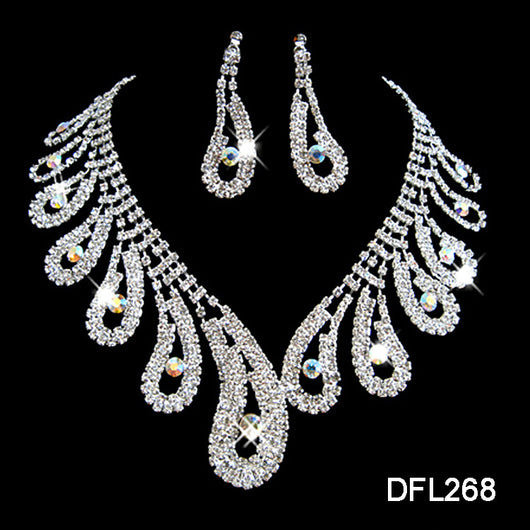 Silver-toned rhinestone necklace and matching drop earrings set with iridescent accents, ideal for bridal or formal wear.