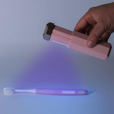 Portable UVC germicidal wand with an octagonal light blue body and a dark brown cap, featuring visible UVC bulbs. - Image 8