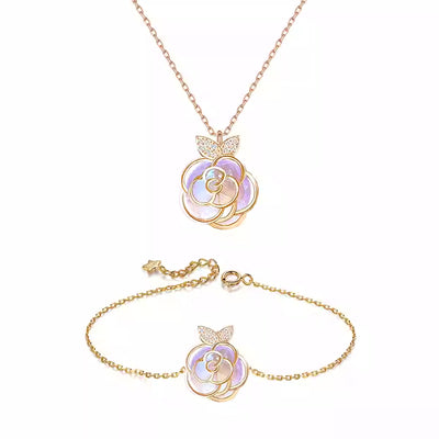 Gold-tone necklace with an iridescent camellia flower pendant and small clear stones on a delicate chain. - Image 11