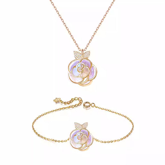 Gold-tone necklace with an iridescent camellia flower pendant and small clear stones on a delicate chain. - Image 11