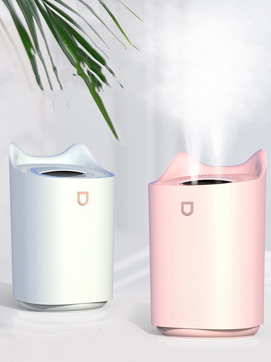Beige double nozzle humidifier with cat ear design emitting mist, shown in a warm-toned indoor setting. - Image 4