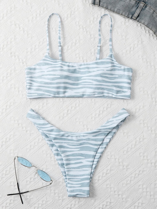 Tan and white zebra stripe two-piece bikini with a bandeau top and high-cut bottom, laid flat. - Image 6