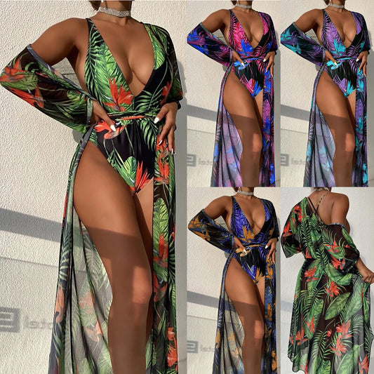 Women's tropical print one-piece swimsuit with deep V-neck and high-cut leg, paired with a matching long-sleeve cover-up.