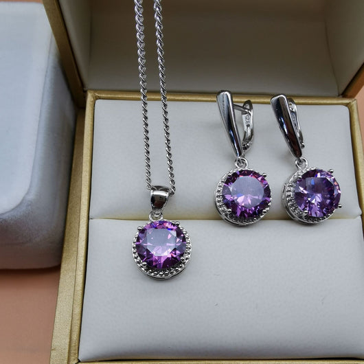 Four-piece silver-tone jewelry set with round green gemstones, including a necklace, bracelet, ring, and dangle earrings. - Image 20