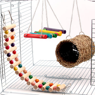 Small animal cage accessories including a flexible wooden ladder with colorful beads, a colorful wooden swing, and a woven grass tunnel. - Image 8