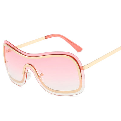 Women's fashionable shield sunglasses with a gold metal frame and dark gray lenses, featuring a unique wavy design. - Image 6