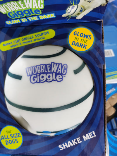 Wobble Wag Giggle dog sound ball, white with green stripes, in blue packaging highlighting glow-in-the-dark feature. - Image 11