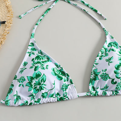 White and yellow floral print three-piece bikini set with a halter triangle top, high-cut bottom, and sheer white sarong. - Image 15