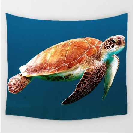 Vibrant tapestry featuring a sea turtle with a brown shell and green flippers swimming in deep blue water.