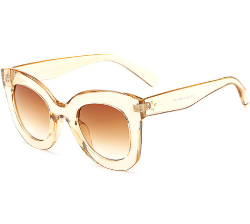 Transparent pink cat-eye sunglasses with gradient gray lenses, featuring a thick frame and vintage style. - Image 9