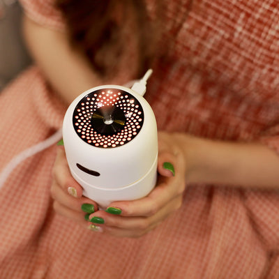 Black portable humidifier with a silver band, a power button, and a water level indicator, suitable for car or home. - Image 7