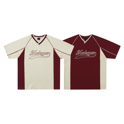 Men's khaki and red color contrast patchwork t-shirt with short raglan sleeves and a V-neck.