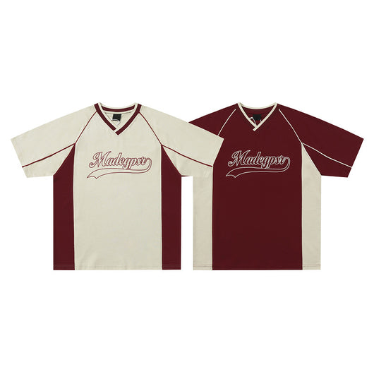 Men's khaki and red color contrast patchwork t-shirt with short raglan sleeves and a V-neck.
