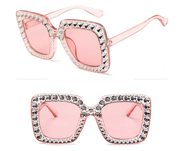 Oversized square sunglasses with clear peach frames, brown lenses, and clear faceted rhinestones around the edges. - Image 6