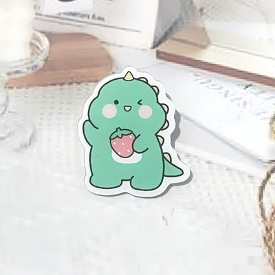 Cute green cartoon dinosaur acrylic badge brooch with a shy expression and small spikes on its back. - Image 18