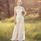 Vestido Pantalón Elegante de Encaje Blanco con Cuello Alto