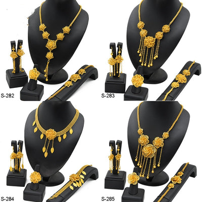 Gold-plated jewelry set with filigree flower designs, including a necklace with dangling chains, matching earrings, a ring, and a bracelet. - Image 2