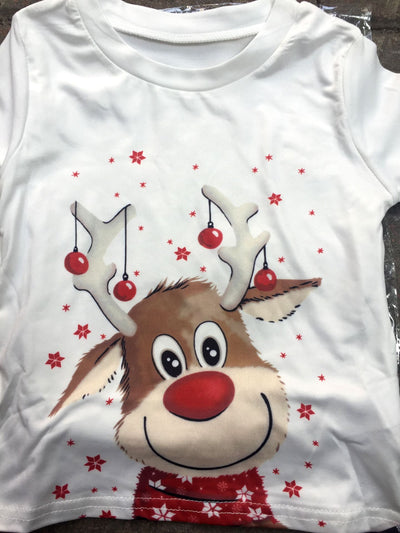 Family of four and a golden retriever wearing matching white long-sleeve reindeer tops and red plaid pajama pants. - Image 20
