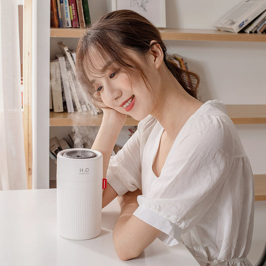 White cylindrical USB rechargeable wireless ultrasonic aromatherapy water mist diffuser lamp with H₂O HUMIDIFIER text. - Image 4