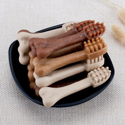 YaHo bone-shaped dog snacks in various brown and tan shades, some with dental nubs, in a black bowl. - Image 9