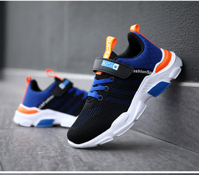 Boy's black and blue sports shoes with orange accents, mesh upper, white sole, blue laces, and a Velcro strap. - Image 41