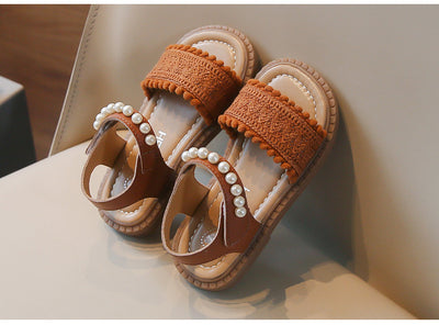Children's white sandals with pearl ankle straps, woven front strap, and brown sole, featuring a Velcro closure. - Image 6