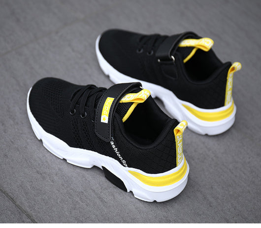 Boy's black and blue sports shoes with orange accents, mesh upper, white sole, blue laces, and a Velcro strap. - Image 25