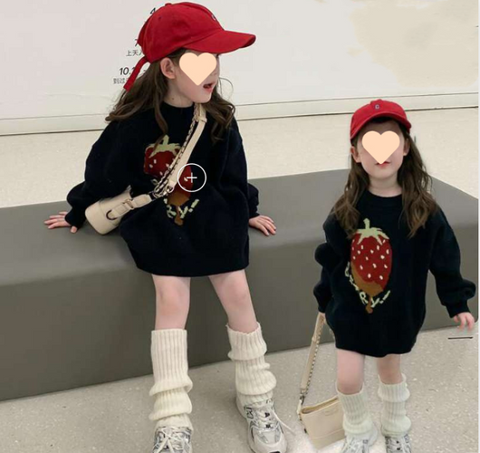 Black knit sweater for kids with a large red strawberry graphic and "BERRY!" text.