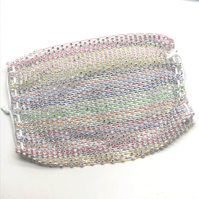 Close-up of a blue mesh fabric adorned with numerous small, clear rhinestones, creating a sparkling texture. - Image 61