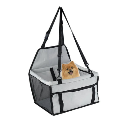 Light grey pet car booster seat with black mesh sides and adjustable straps, installed on a black and red car seat. - Image 23