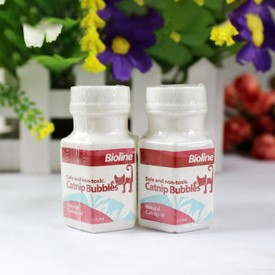 Bioline Catnip Bubbles bottle with a red label, featuring a cat silhouette and text "Safe and non-toxic. Natural Catnip oil 17.7ml". A white bubble wand is next - Image 6