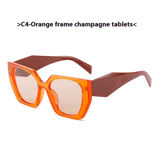 Retro cat-eye sunglasses with a vibrant orange frame, brown temples, and light champagne-colored lenses. - Image 13