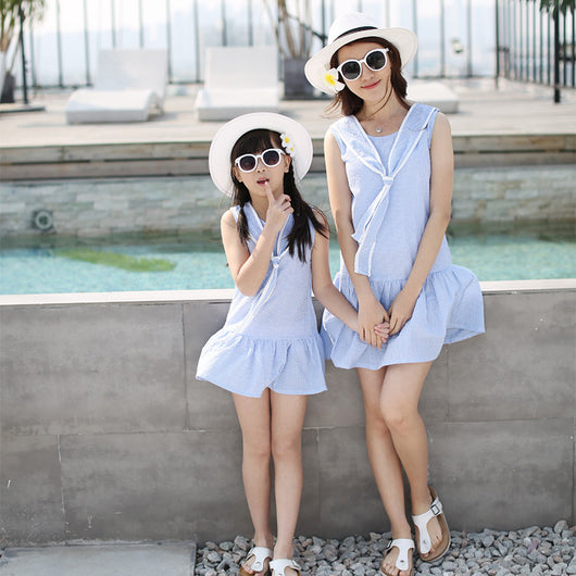 Kids in matching Korean-style summer outfits: boy in white polo and blue gingham shorts, girl in blue gingham dress. - Image 6
