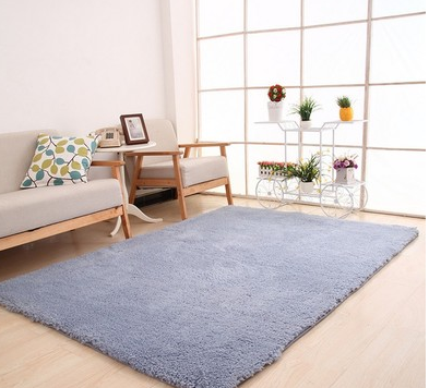 Fluffy purple rectangular area rug on a light wood floor in a modern living room with a sofa and plant stand. - Image 4