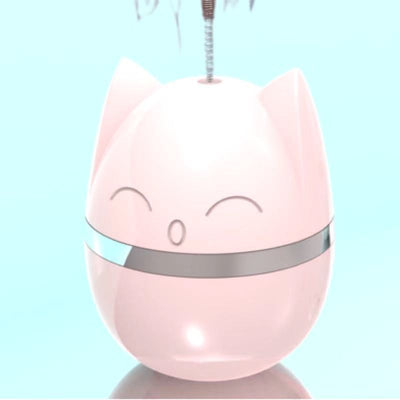 Pink cat-shaped tumbler toy with a feather attachment, featuring a cute face and silver band. - Image 13